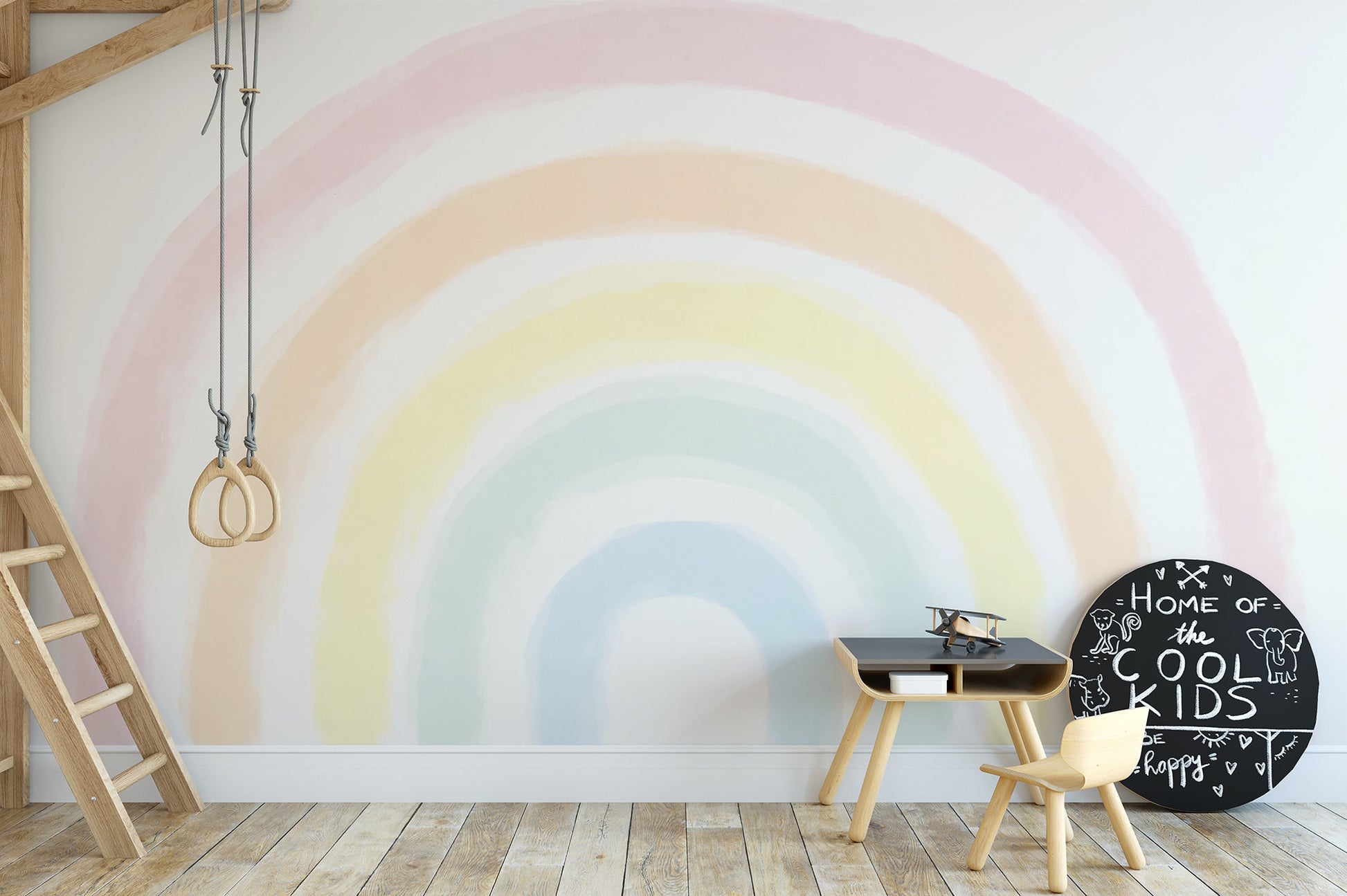 Create a fairy-tale vibe with a Pastel Rainbow Mural in kids rooms