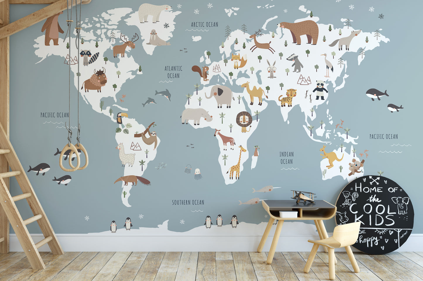 Soft blue kids map wallpaper with wildlife details
