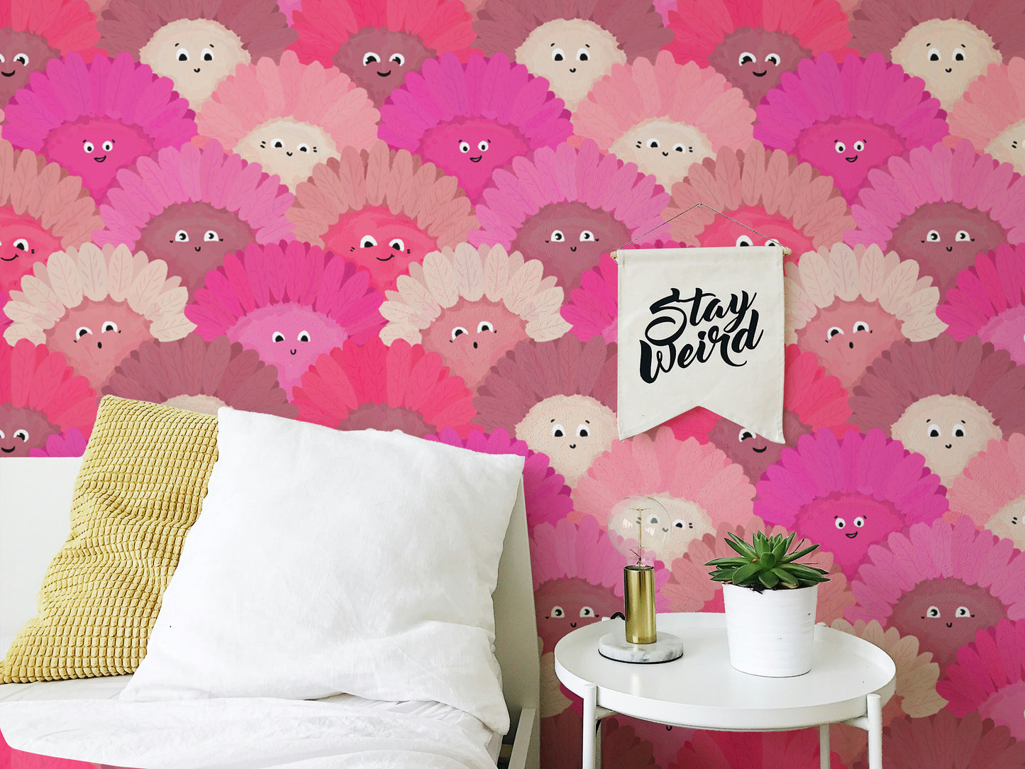 Whimsical pink flower faces mural for a cheerful wall accent.
