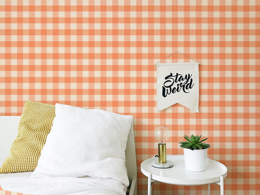 Charming peach gingham wallpaper for a cozy, vintage-inspired look.
