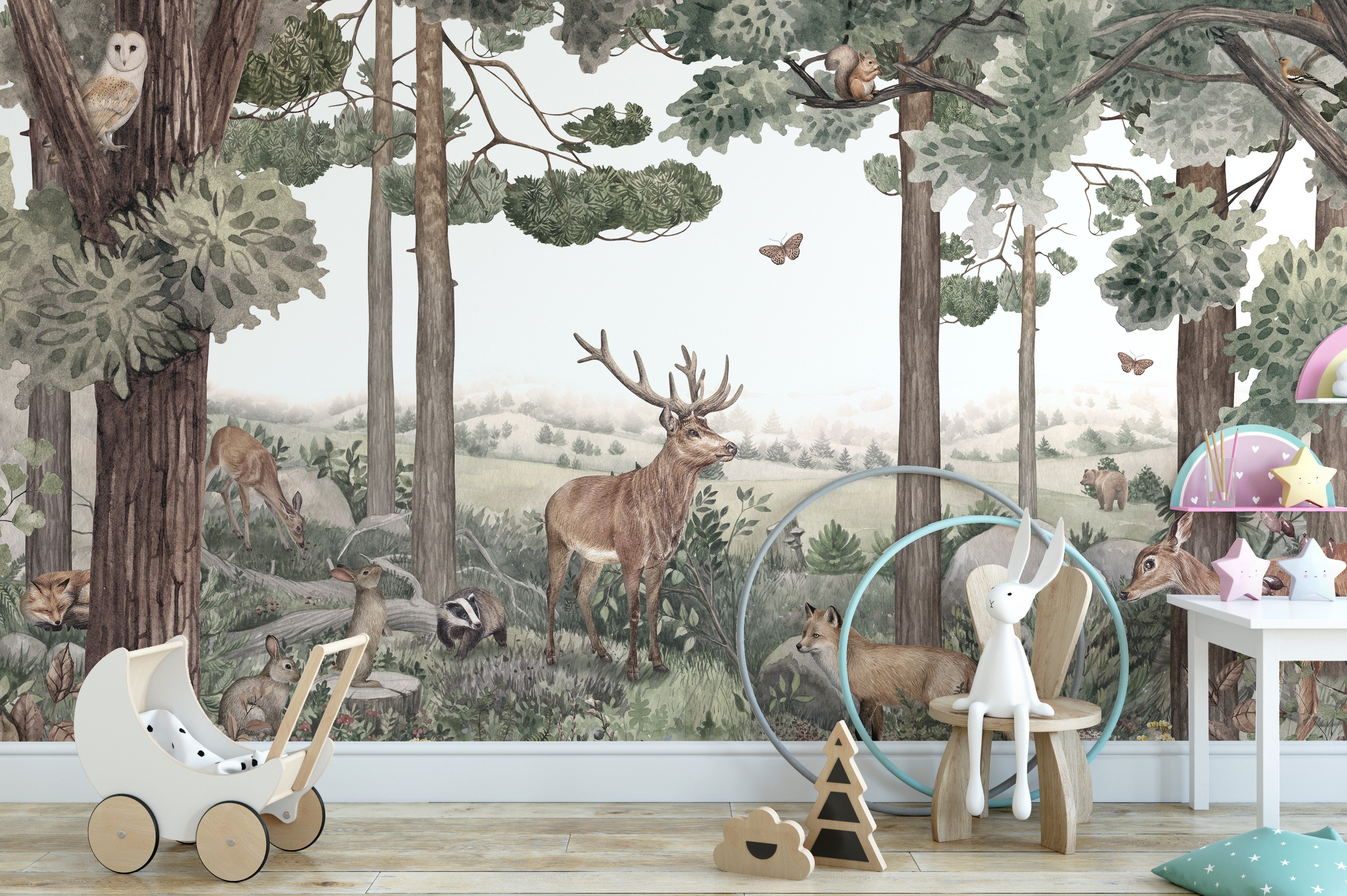 Forest-themed wallpaper mural with stag, deer, and trees