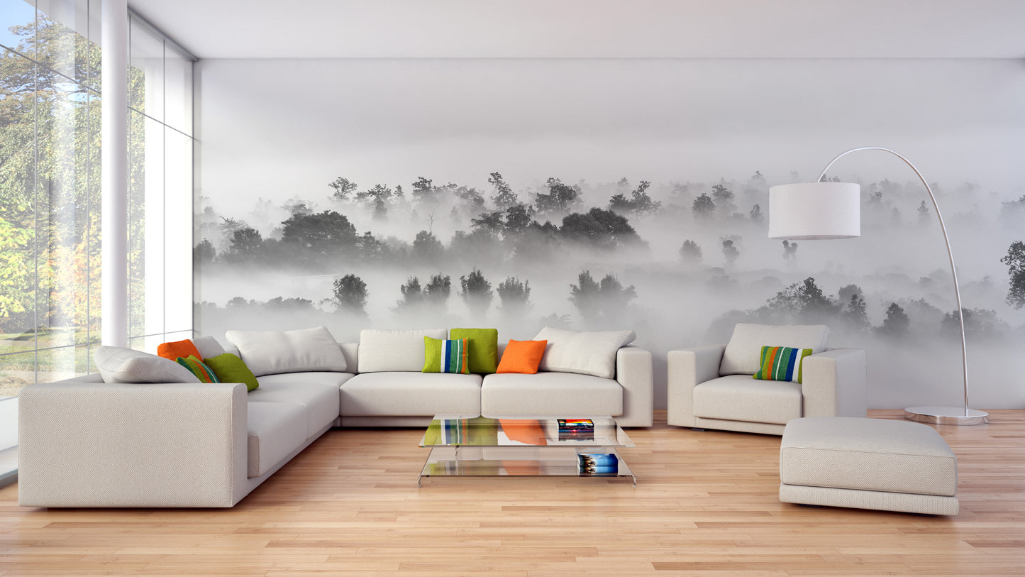 Grayscale forest mural with clouds and trees.