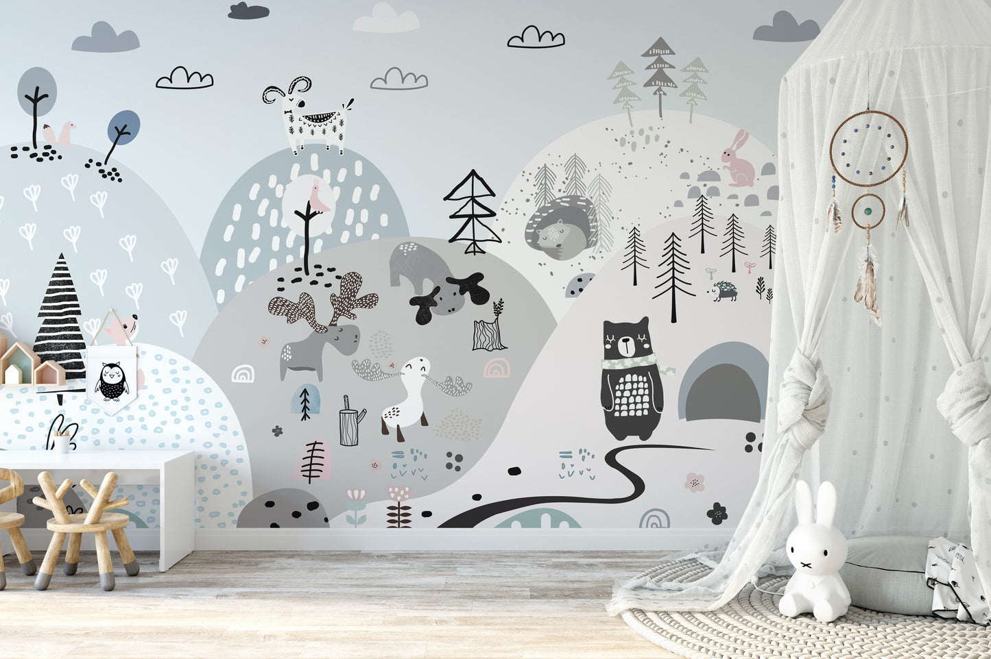 Playful forest animals wallpaper on scenic hilly backdrop