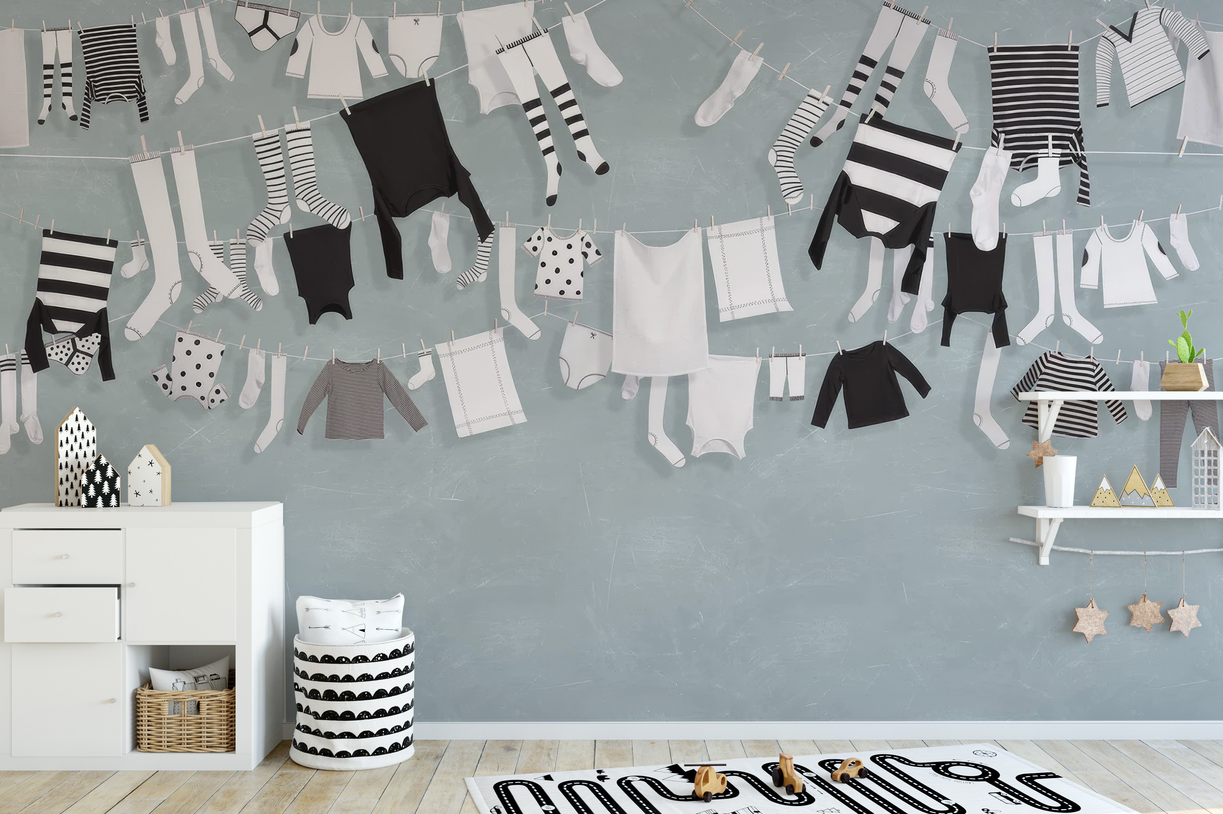 Stylish laundry line with black and white clothes mural